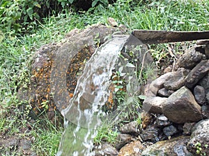 The small stream made by people in the village.