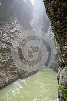 Small stream with rock valley with sunlight in Aare gorge Aareschlucht for background