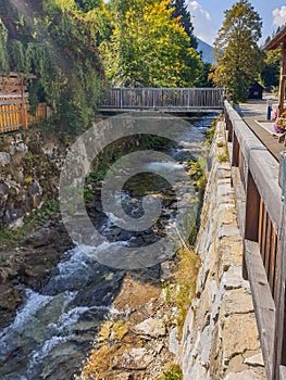 Small stream in a village with a bridge photo