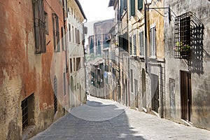 Small street in Siena, Italy photo