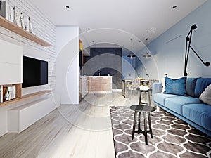 Small studio apartment with kitchen, dining room and living room with sofa. Interior in blue and white colors and wooden elements