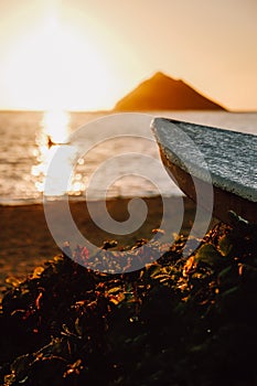 Small surfboard on the Lanikai beach, Oahu, Hawaii at sunset