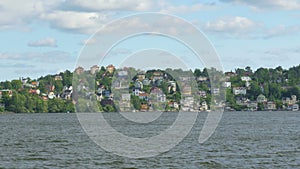 small swedish village view from ship board, near stockholm, sweden