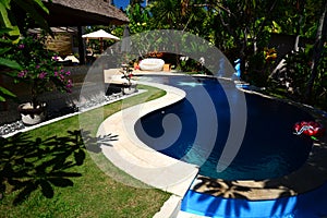 Small swimming pool in the tropical shade