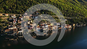 A small Swiss village. Fishing village. Tourist location. Gandria. Lugano. Dawn. Old architecture. Mountainous terrain