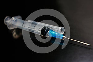 Small syringe with a needle