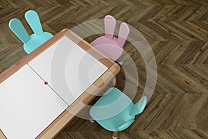 Small table and chairs with bunny ears in children`s room