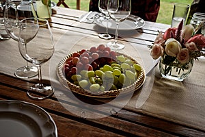 Small table flower luxury decoration with green and red grapes wedding event party indoor photo