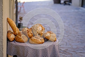 Small table with several types of bread.