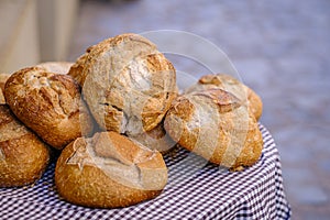 Small table with several types of bread.