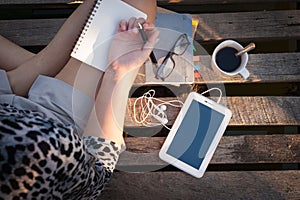 Small tablet on wood bridge