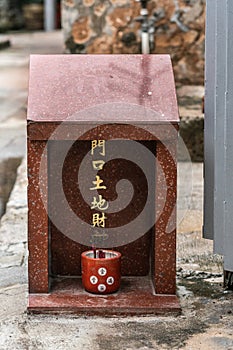 Small Taoist shrine in street of Tai O, Hong Kong China