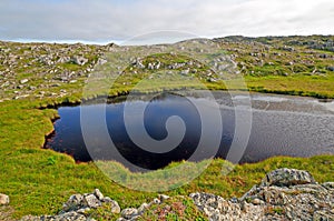 Small tarn on a remote hillside