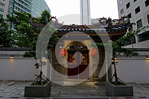 Small temple in downtown business center of Singapore