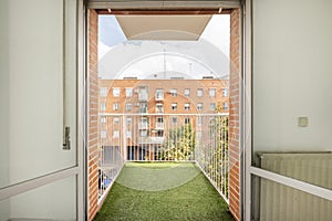 Small terrace with white metal railing