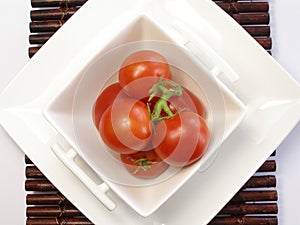 Small tomatoes in a chinaware