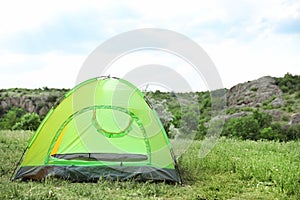 Small tourist tent in wilderness