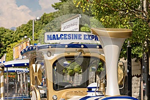 Small tourist train in Malcesine town - Lake Garda Italy