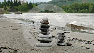 Small towers of round stones on the beach