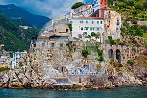 Small town of Amalfi village with colorful houses, located on rock, Amalfi Mediterranean coast with Gulf of Salerno, Campania, Ita