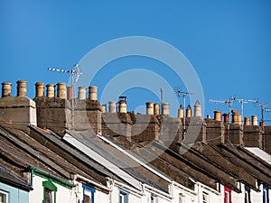 Small town house rooftops, England, UK. Aerials and blue sky. photo