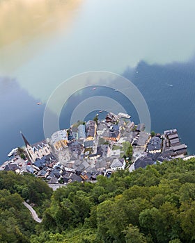 Small town on the lakeside surrounded by green forested hills