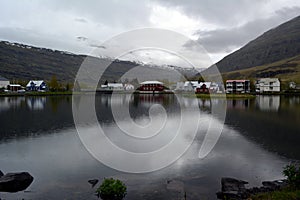 Small town of Seydisfjordur on the shore of the lake in the west of Iceland