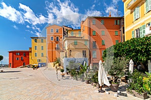 Small town square and colorful houses in Menton