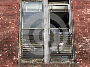 Small town USA downtown Gibson Georgia busted out window