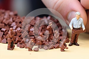 Small toy chocolatier making chocolates