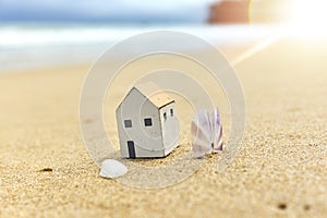 Small toy house on the beach