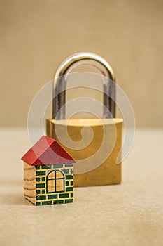 Small toy house and padlock