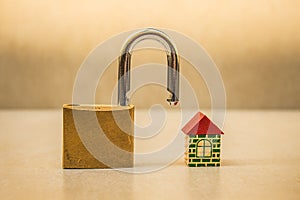 Small toy house and padlock