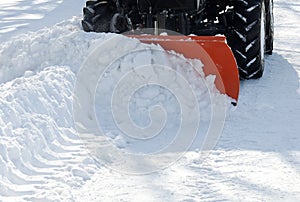 Small tractor snow removal in the park