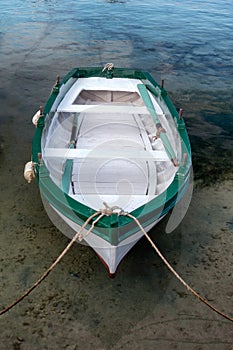 Small traditional wooden fishing boat in harbor