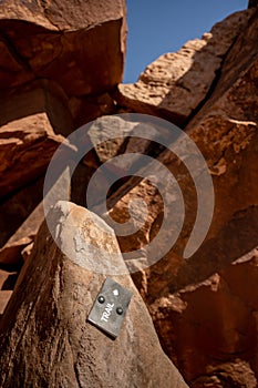 Small Trail Directional Sign Through Rocks