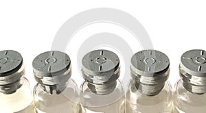 Small transparent bottles with gray rubber caps. Five closed beakers standing in a row on a white background. Isolate