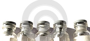 Small transparent bottles with gray rubber caps. Five closed beakers standing in a row on a white background. Isolate Medical