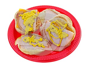 Small turkey sandwiches with mustard