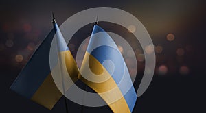 A small Ukraine flag on an abstract blurry background