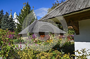 Ukrainian traditional house with a flower garden