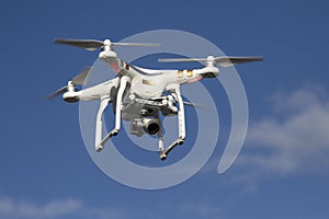 Small unmanned helicopter with a camera flying in the