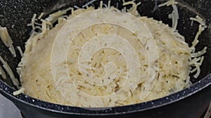 small vermicelli boiled food in a pan