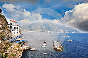 Small vessels sailing along the coast line in Praiano, Amalfi Coast