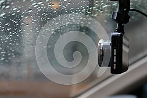 Small video camera record inside motor vehicle on windshield