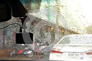 Small video camera record inside motor vehicle on windshield