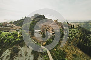 Small village of Chiusure on top of the hill surrounded by Karst cliffs landscape photographed with a drone.