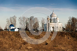 A small village church on a high hill. Church on the banks of the river. Old Orthodox Church