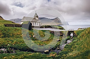 Small village church on the sea shore in Vidareidi, Faroe Islands, Denmark