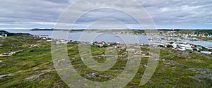 Small village community in Newfoundland. Houses nestled amongst rocky landscape in Twillingate Newfoundland, Canada.